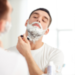 Man shaving his jaw